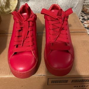 Red leather Coach sneakers